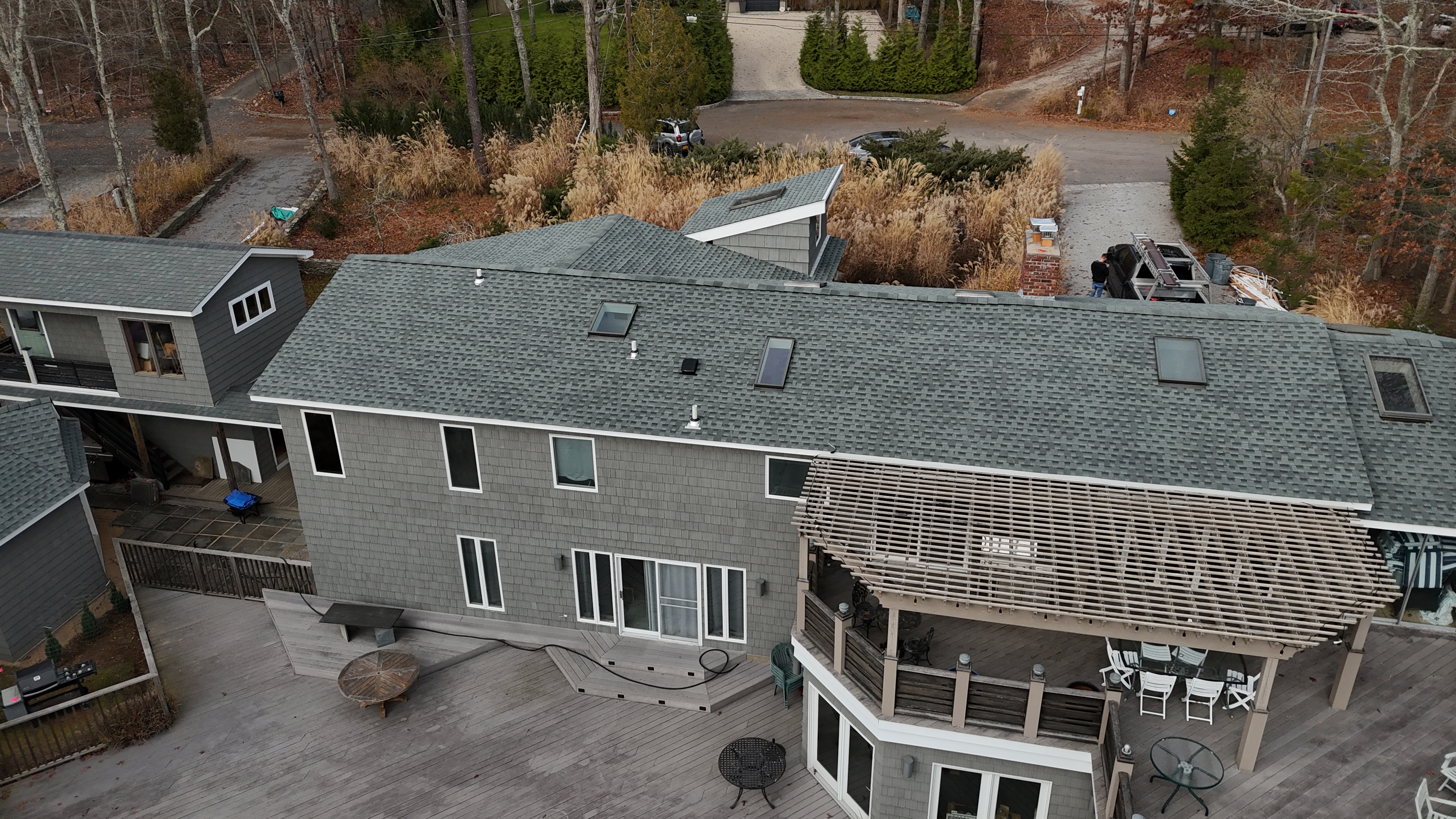Wide roof plane with GAF architectural shingles and skylights